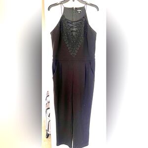 Worn once. Express jumpsuit with lace up detail.